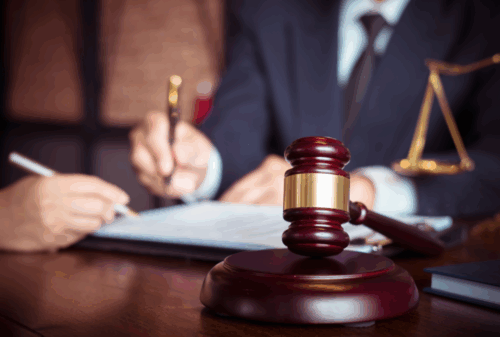 Image is of a lawyer working on a client's case with legal assistant, concept of criminal defense lawyer in Atlantic Beach