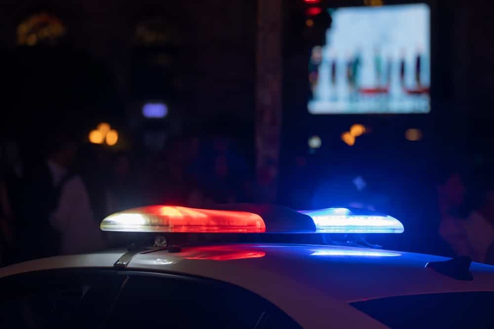 Police lights during DUI traffic stop at night