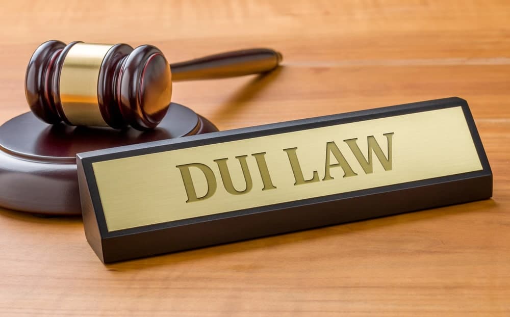 Image is of a courtroom gavel and a DUI Law nameplate, concept of legal consequences that may follow arrests made at DUI checkpoints in Ponte Vedra Beach.