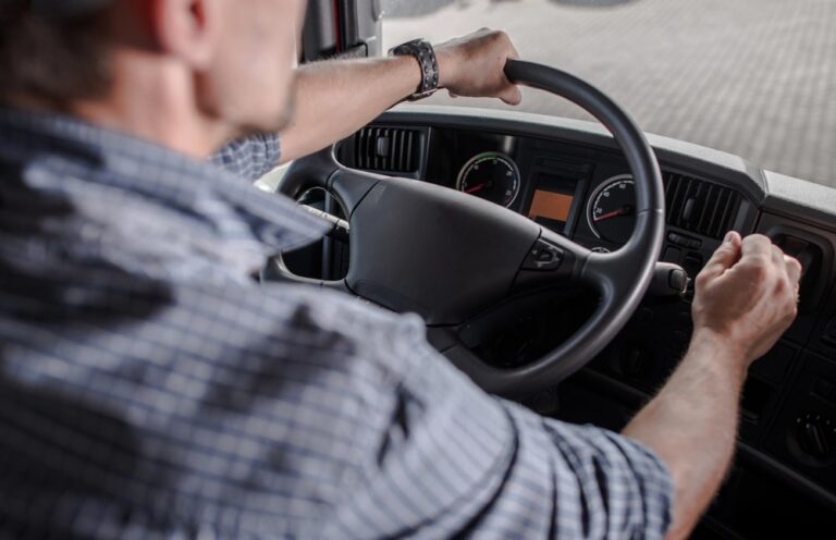 Image is of a commercial vehicle driver seen from inside the cab, highlighting how daily work routines can be disrupted by DUI arrests in Florida for CDL holders.