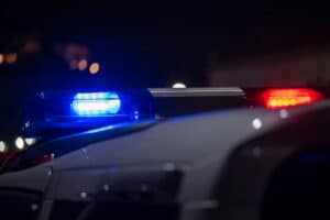 Image is of police lights at night, concept of evidence review in Ponte Vedra Beach DUI cases.