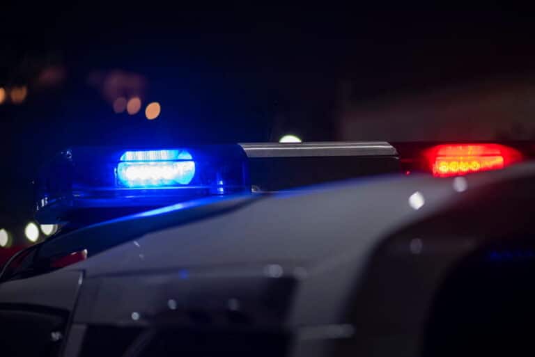 Image is of police lights at night, concept of evidence review in Ponte Vedra Beach DUI cases.