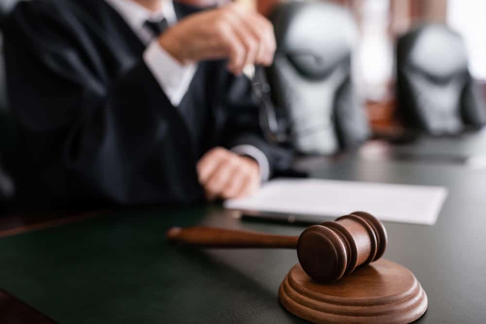 Image is of a courtroom gavel during legal proceedings, concept of DV charges in Ponte Vedra Beach.