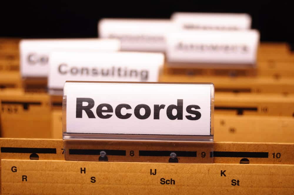 Image is of archived criminal records, concept of reviewing prior convictions that may affect Ponte Vedra Beach drug charges.