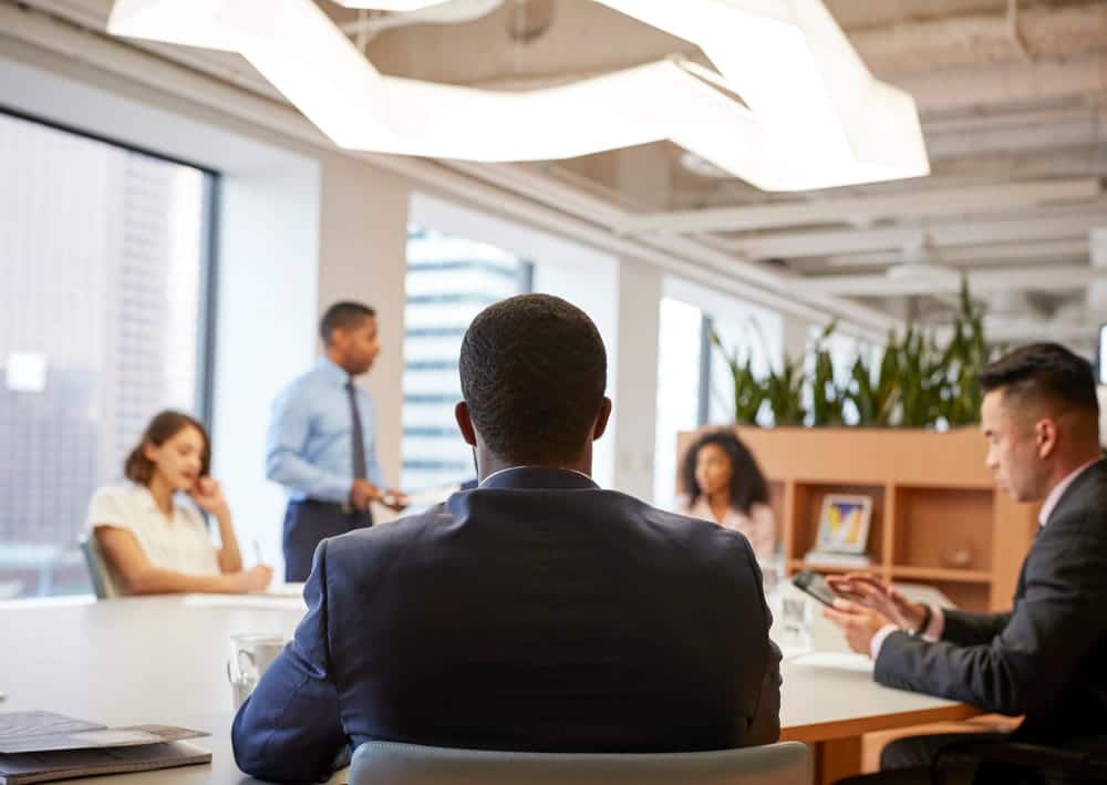 Image is of professionals participating in a hiring meeting, concept of whether a DUI affect your job prospects during employment decisions.