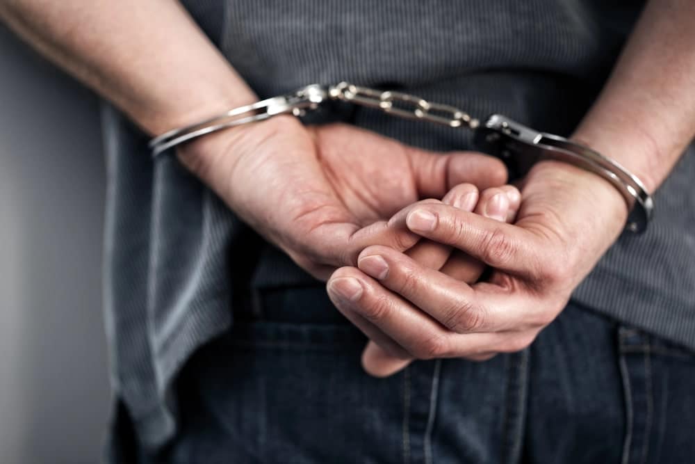 Image is of a person wearing handcuffs, concept of an arrest in a drug case in Ponte Vedra Beach.