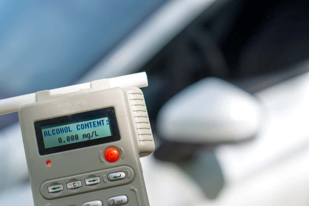 Image is of an ignition interlock device displaying an alcohol reading, representing ignition interlock rules after a DUI.