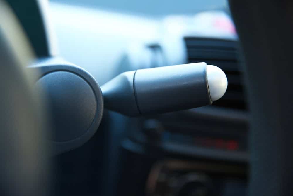 Image is of a vehicle ignition control, representing how ignition interlock rules can affect driving after a DUI.