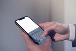 Image of a person typing a text message on a smartphone, illustrating communication concerns following a DV Arrest in Ponte Vedra Beach.